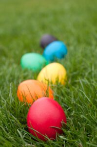 Easter eggs in a row on the meadow