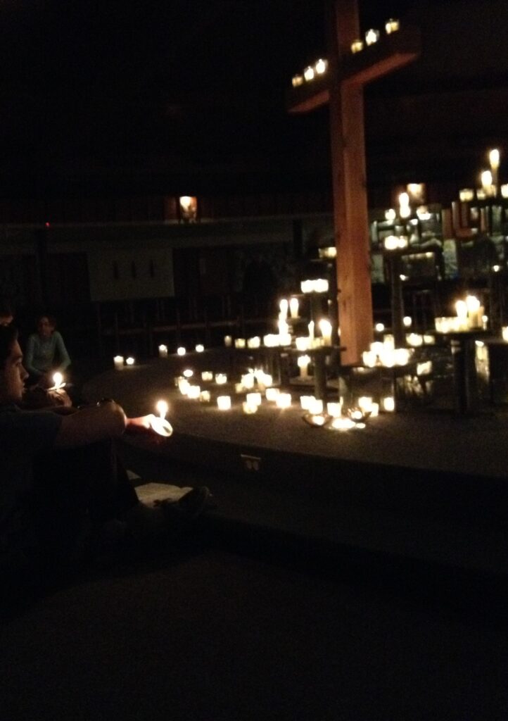 Image of Taize Service with a cross and candles